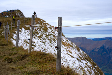 Mountain panorama with fresh snow seen from Axalp at Bernese Highlands on a grey cloudy autumn day. Photo taken October 19th, 2021, Brienz, Switzerland.
