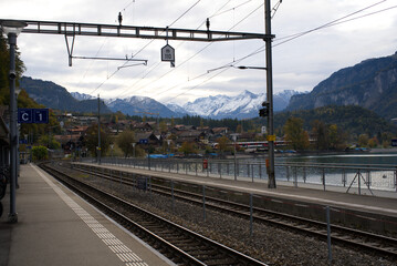 Railway station at village of Brienz at Bernese Highlands on a grey and cloudy autumn day. Photo taken October 19th, 2021, Brienz, Switzerland.