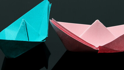 pink and blue paper boat isolated on white background