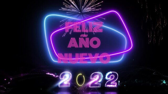 Felicitaci&oacute;n a&ntilde;o nuevo 2022 con luces de ne&oacute;n y fuegos artificiales
