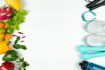 Healthy lifestyle, food and sport concept. athlete's equipment and fresh fruit on white background.
