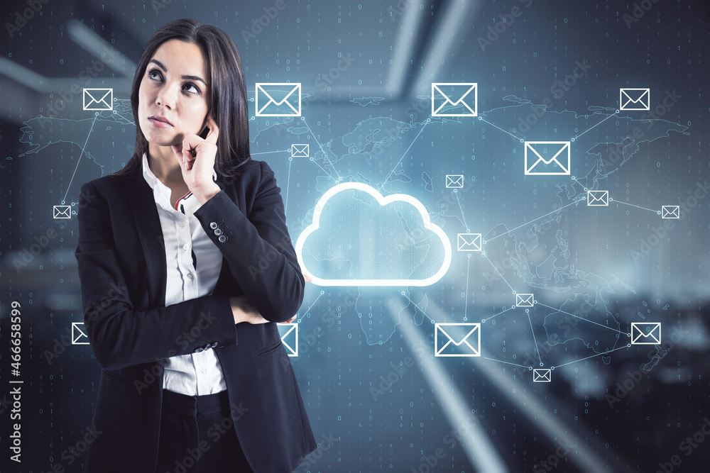 Canvas Prints Attractive pensice european businesswoman standing in blurry office interior with glowing cloud hologram. Cloud computing and database concept. Double exposure.