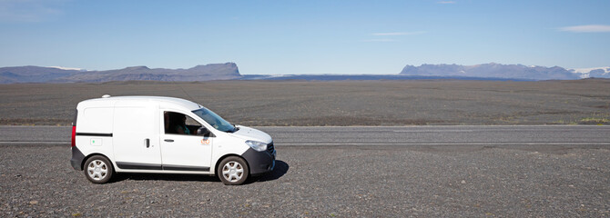 Fototapeta na wymiar Iceland on july 30, 2021: A small camper on the road in Iceland, the first big tourist season since the Corona-lockdown of 2020