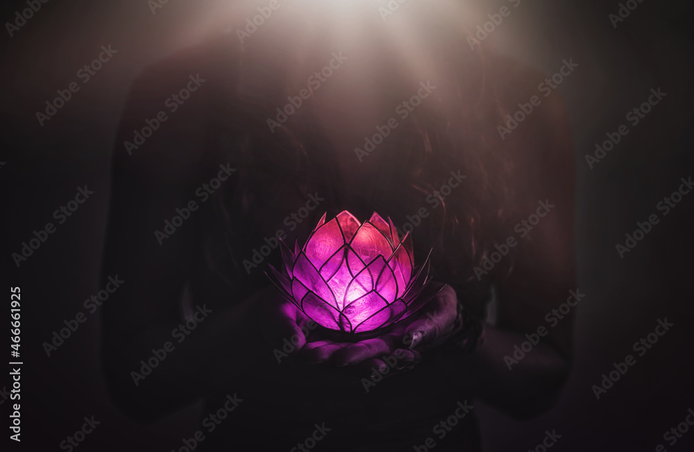 Wall mural beautiful meditating woman with lotus candle in her hand. - Wall murals