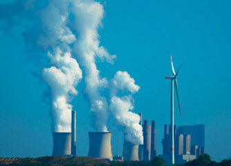 Panoramic view of coal-fired power station with smoking cooling towers. Neurath North Rhine Westphalia, Germany