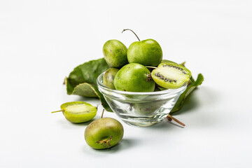 Ripe Actinidia arguta or kiwi isolated on white background