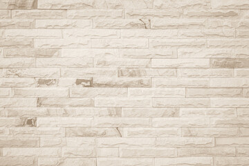 Empty background of wide cream brick wall texture. Beige old brown brick wall concrete or stone textured wallpaper backdrop.