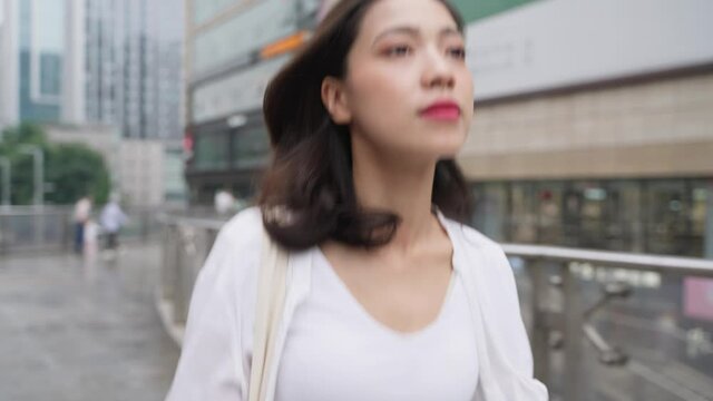 portrait of a woman walking in the street