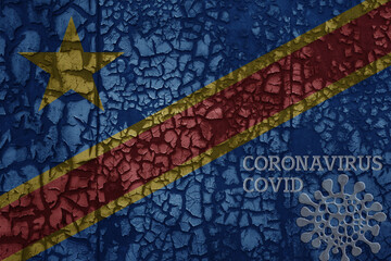 flag of democratic republic of the congo on a old metal rusty cracked wall with text coronavirus, covid, and virus picture.