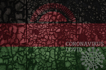 flag of malawi on a old metal rusty cracked wall with text coronavirus, covid, and virus picture.