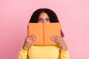 Photo of cute excited dark skin woman wear yellow sweater spectacles holding copybook cover lips face isolated pink color background - Powered by Adobe