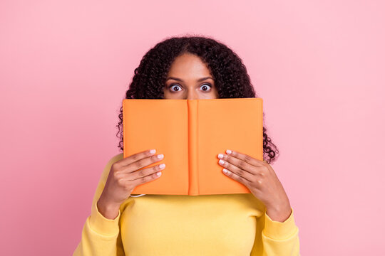 Photo of cute excited dark skin woman wear yellow sweater spectacles holding copybook cover lips face isolated pink color background