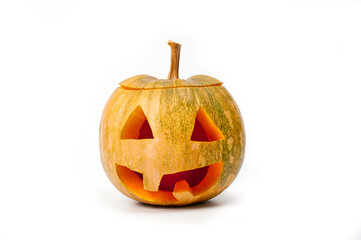 A pumpkin lantern, a Halloween attribute resembling a head with a frightening or funny face, shot against a white background.