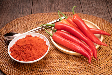 Korean pepper powder and red pepper in wooden plate, Korean  chili powder on wooden table background