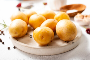 Peeled potatoes for cooking, raw potato on a table