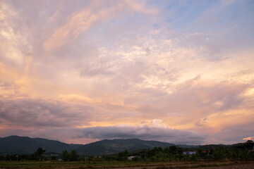 Obraz premium The white clouds have a strange shape and moutain. The sky and the open space have mountains below. Clouds floating above the mountains.