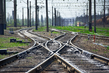 Railway tracks crossing and intersecting. Shows cross roads and Railroad switch.
