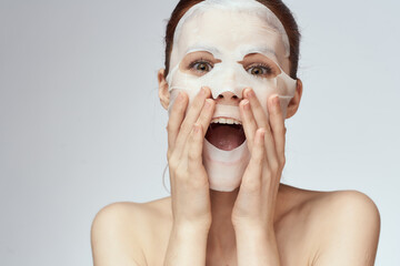 woman with bare shoulders face mask skin care procedures