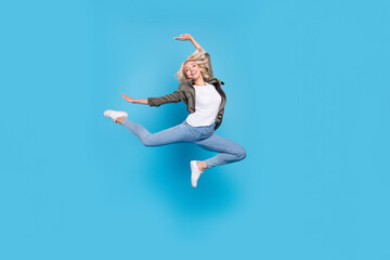 Full length body size photo woman jumping up dancing isolated pastel blue color background