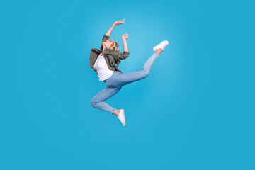 Fototapeta na wymiar Full length body size photo woman jumping up gracefully isolated pastel blue color background