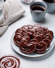 Tasty breakfast with chocolate palmier pastry cookies and black coffee, top view