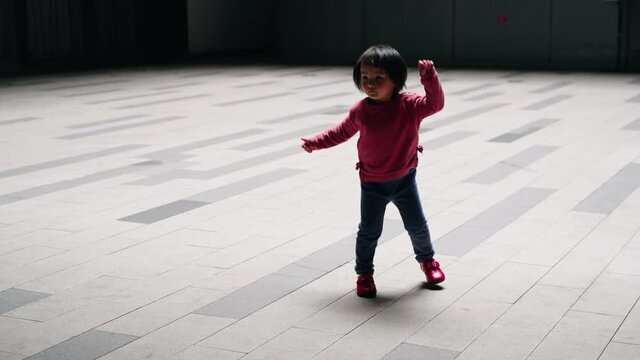 Slow Motion Of Lovely Asian Child Dancing In The Urban City Street