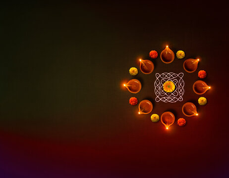 clay oil lamps lit on dark background wit circular formation of lamp and marigold flowers  Diwali backgrounds, Diwali lamps Indian festival.