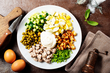 Ingredients for salad in transparent plates.