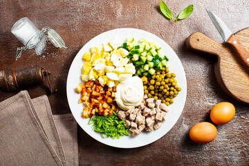 Ingredients for salad in transparent plates.