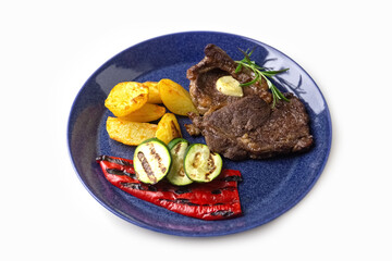 Grilled vegetables and beef steak on a plate. Delicious and healthy food. Isolate. Photo