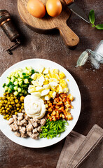 Ingredients for salad in transparent plates.
