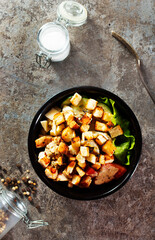 Healthy chicken salad with vegetables and croutons