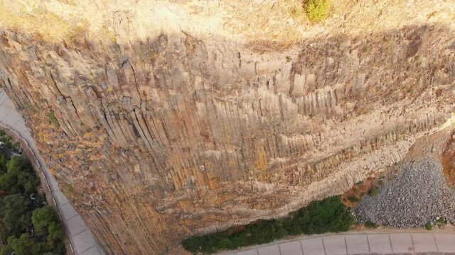 Birds eye view birds fly in nesting area in Garni gorge, Armenia