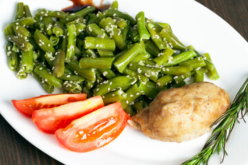 baked asparagus beans with sesame seeds and meat cutlet