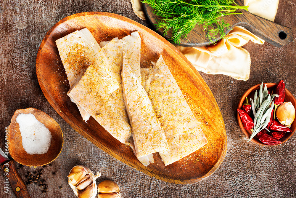 Sticker fish fillet on a woodentray. white fish prepare for cooking