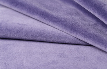 Bright lilac velour textile sample. Fabric texture background