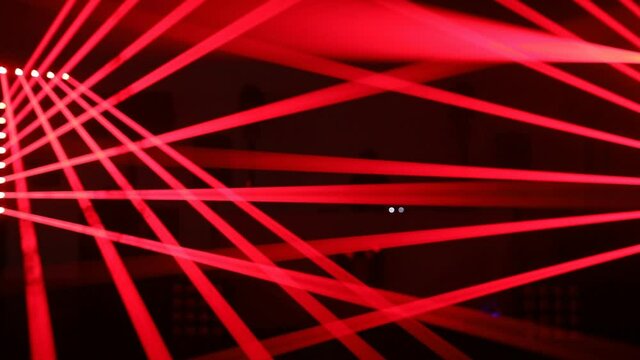 Glowing red stripes of light on the dance floor