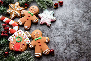 Homemade gingerbread cookies border with copy space on dark background