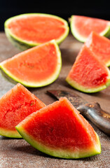 Fototapeta na wymiar Fresh sliced watermelon on dark background