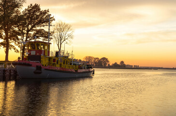 Icebreaker in the rays of the setting sun 