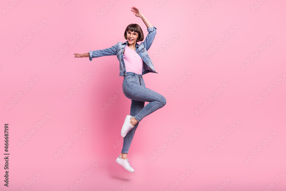 Sticker Full length body size view of attractive cheerful girl jumping dancing having fun rest isolated over pink pastel color background