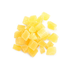Delicious yellow candied fruit pieces on white background, top view