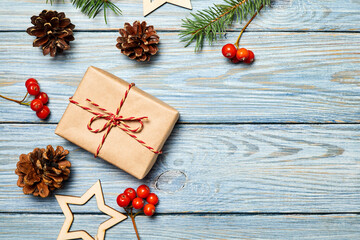 Christmas composition of gift boxes on wooden background with christmas accessories