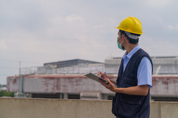 Engineers take note of industrial plant inspections.