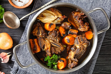 beef broth of beef meat on bones with spices