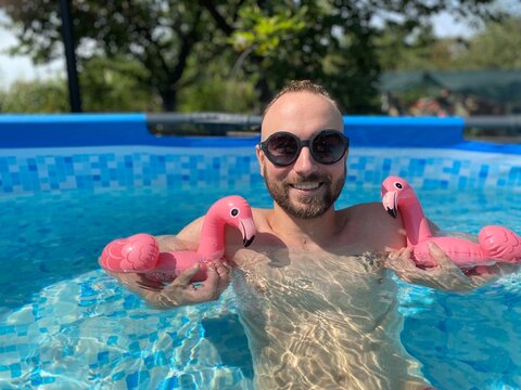 Parent Man In Pool With Flamingo