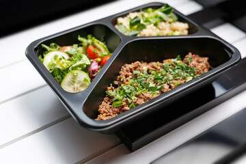 Box diet, appetizing take-away lunch.
Appetizing ready-to-go dish served in a disposable box....