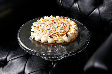 Shortcrust pastry with apples, meringue and nuts. Sweet dessert.
A tasty dish.Culinary photography. Suggestion to serve the dish.