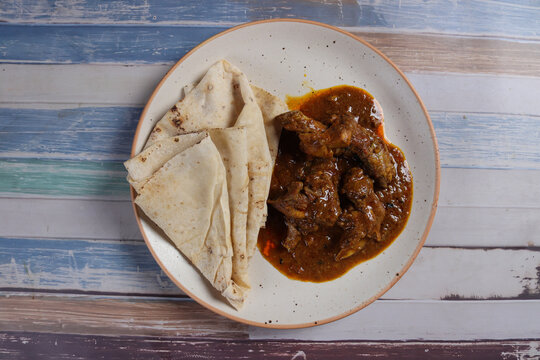 Chicken curry with rumali roti
