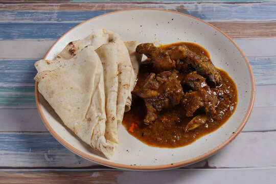 Chicken curry with rumali roti